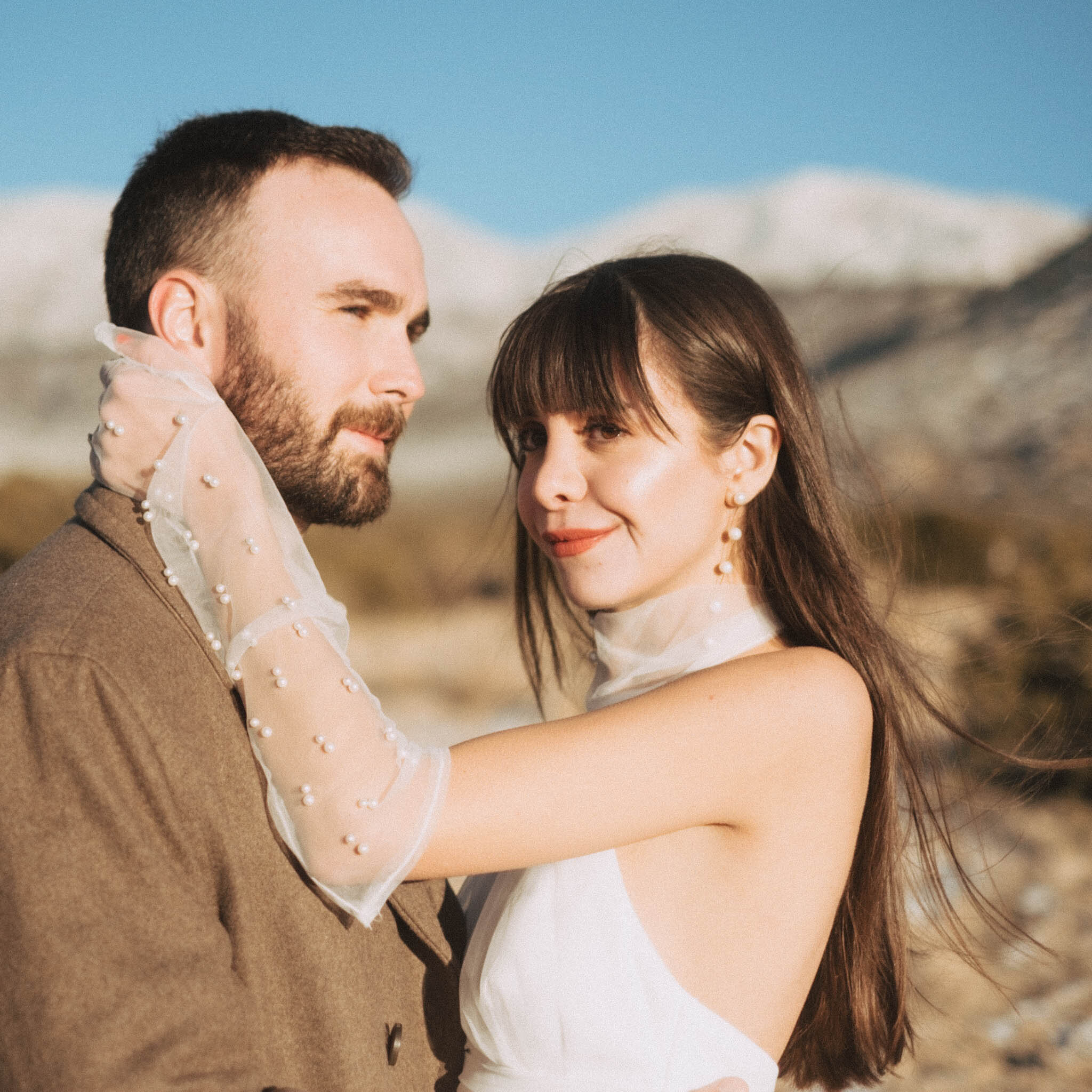 Couple embracing in desert
