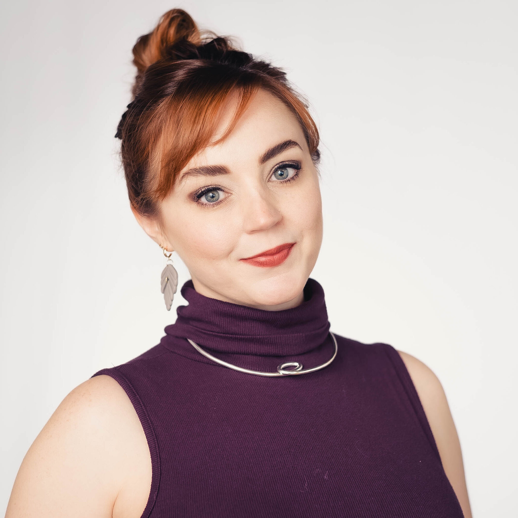 Studio headshot in plum