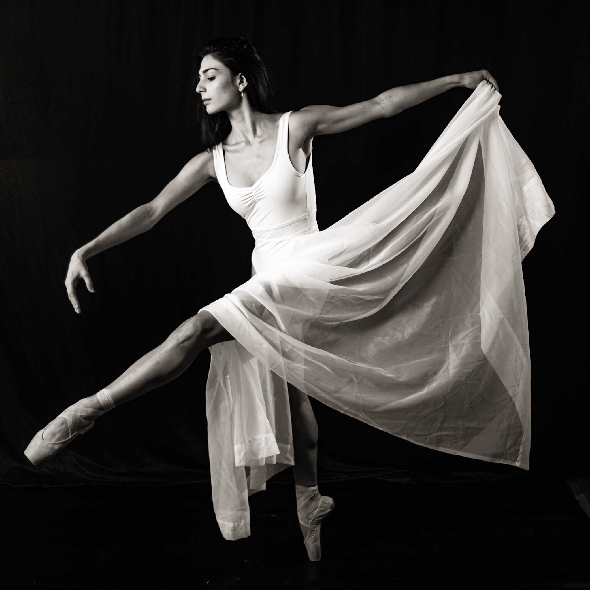 Black and white dancer in flowing fabric