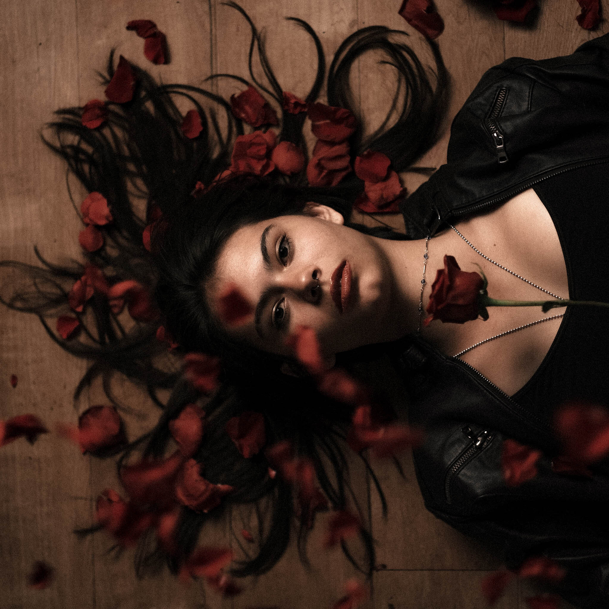Portrait amid dark florals