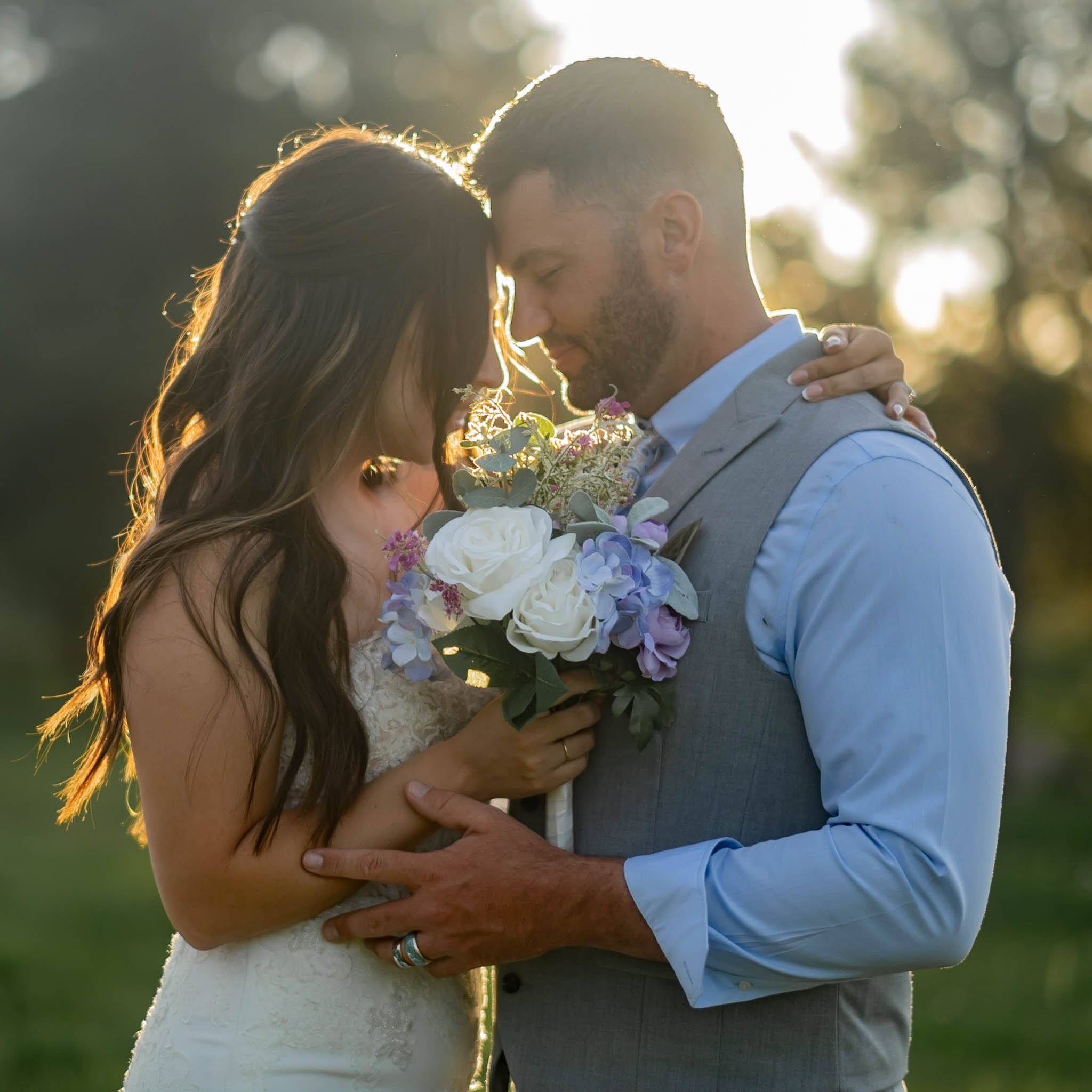 Bride holding bouquet in golden light